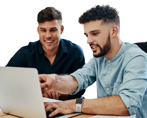 Two young professionals looking at a laptop together