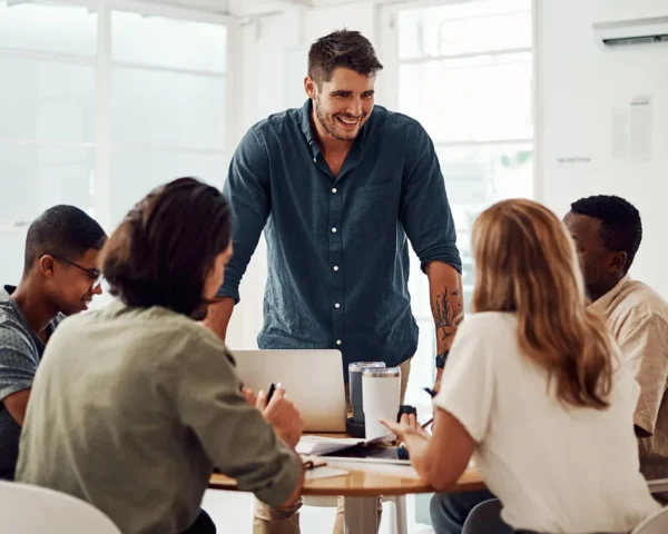 team of 5 discussing around the table